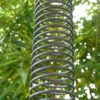 Ornemental stainless steel downspout shaped like a spring